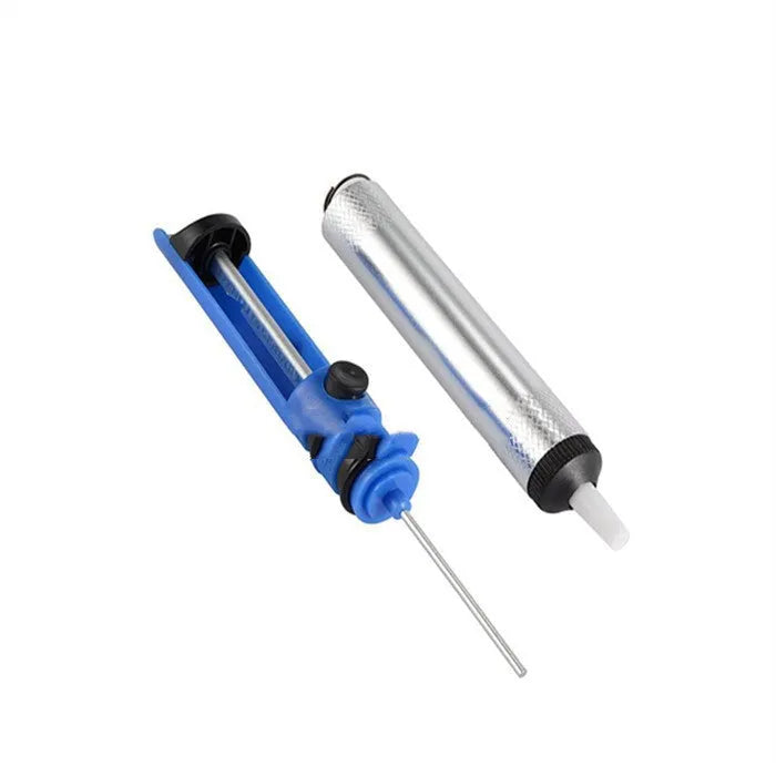 Blue manual solder sucker desoldering tool with silver nozzle on a workbench.