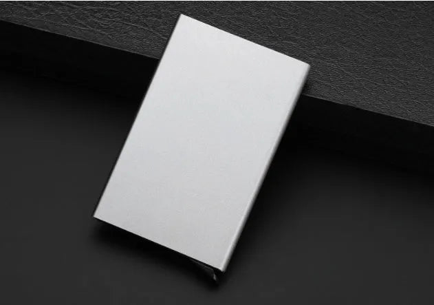 Geometric aluminium business card holder in six colour options showing dimensions