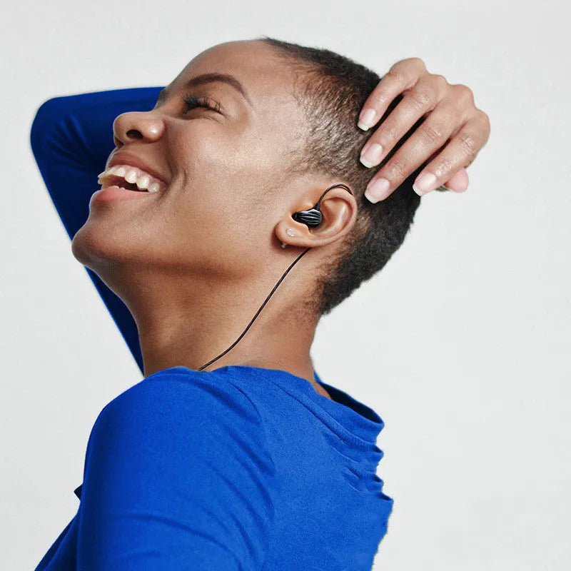 White in-ear sports headphones with back-wound cable design and 3.5mm plug