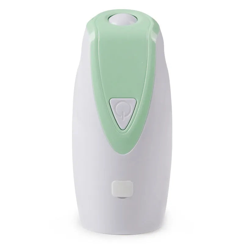 Green USB charging automatic rotating laser cat toy with ABS plastic body on a table