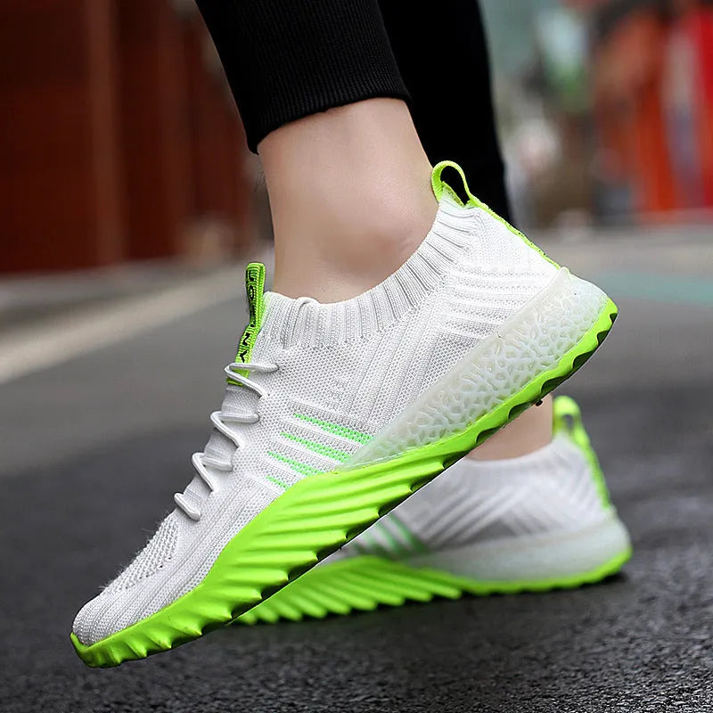 Flying woven mesh breathable sneakers in white orange with rubber sole and car suture detail