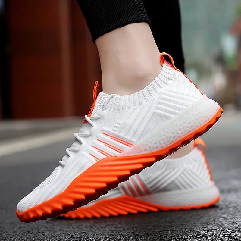 Flying woven mesh breathable sneakers in white orange with rubber sole and car suture detail