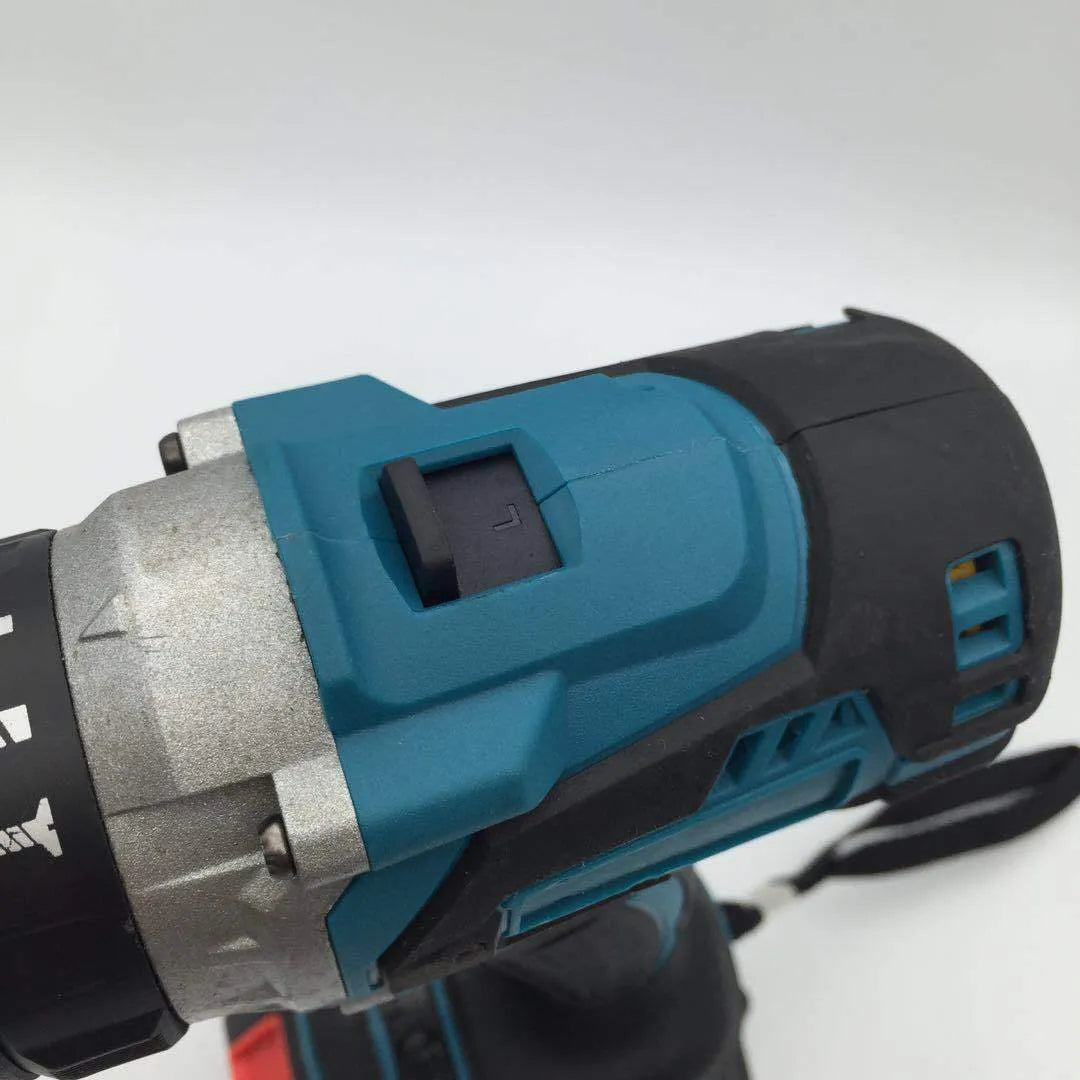 21V cordless impact drill with keyless chuck, lithium-ion battery, and charger on a workbench.