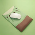 Kiwi fruit design on a grey cloth mouse pad with a thick, integrated gel wrist rest at the front.