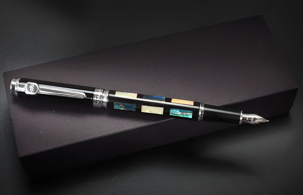 Ceramic colour lacquer pen with rotating ink mechanism and wood-finish barrel in boxed packaging.
