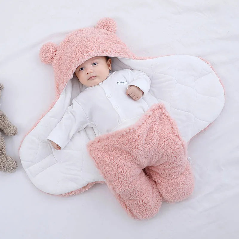 Cotton blend baby quilted sleeping bag wrapper in light blue, shown with size labels for 3M, 6M, and 9M.