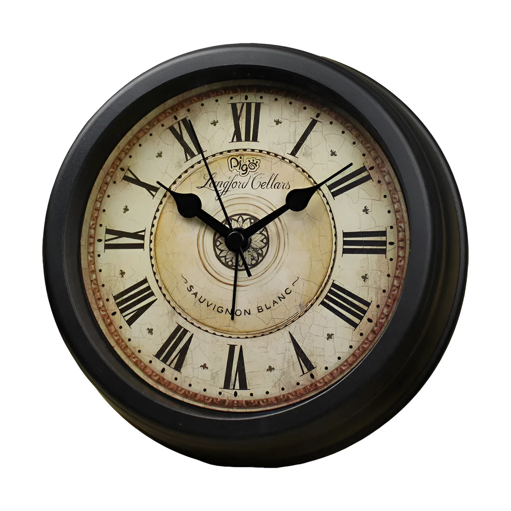 Round European retro style desk clock with silent alarm on a wooden desk.