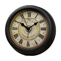 Round European retro style desk clock with silent alarm on a wooden desk.