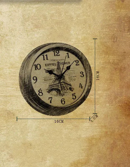 Round European retro style desk clock with silent alarm on a wooden desk.