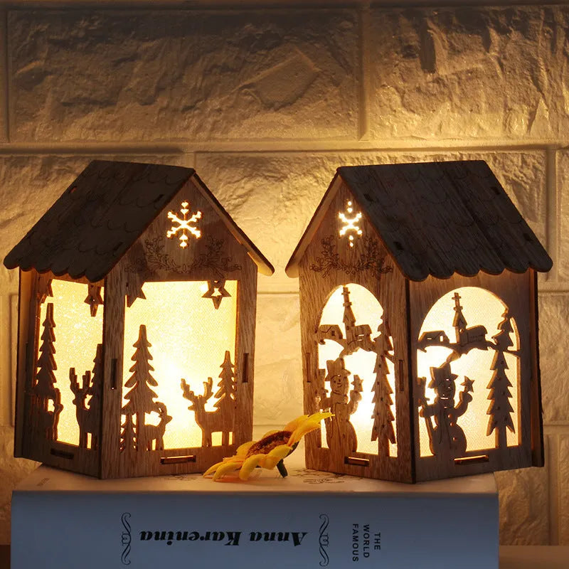 Set of three handmade wooden Christmas decorations: a log bell and two rustic houses with old man and snowman.