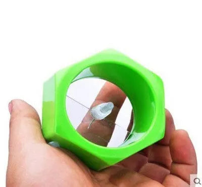 Yellow and green spiral vegetable cutter kitchen tool with food-grade ABS plastic construction.