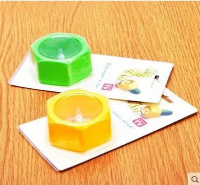 Yellow and green spiral vegetable cutter kitchen tool with food-grade ABS plastic construction.