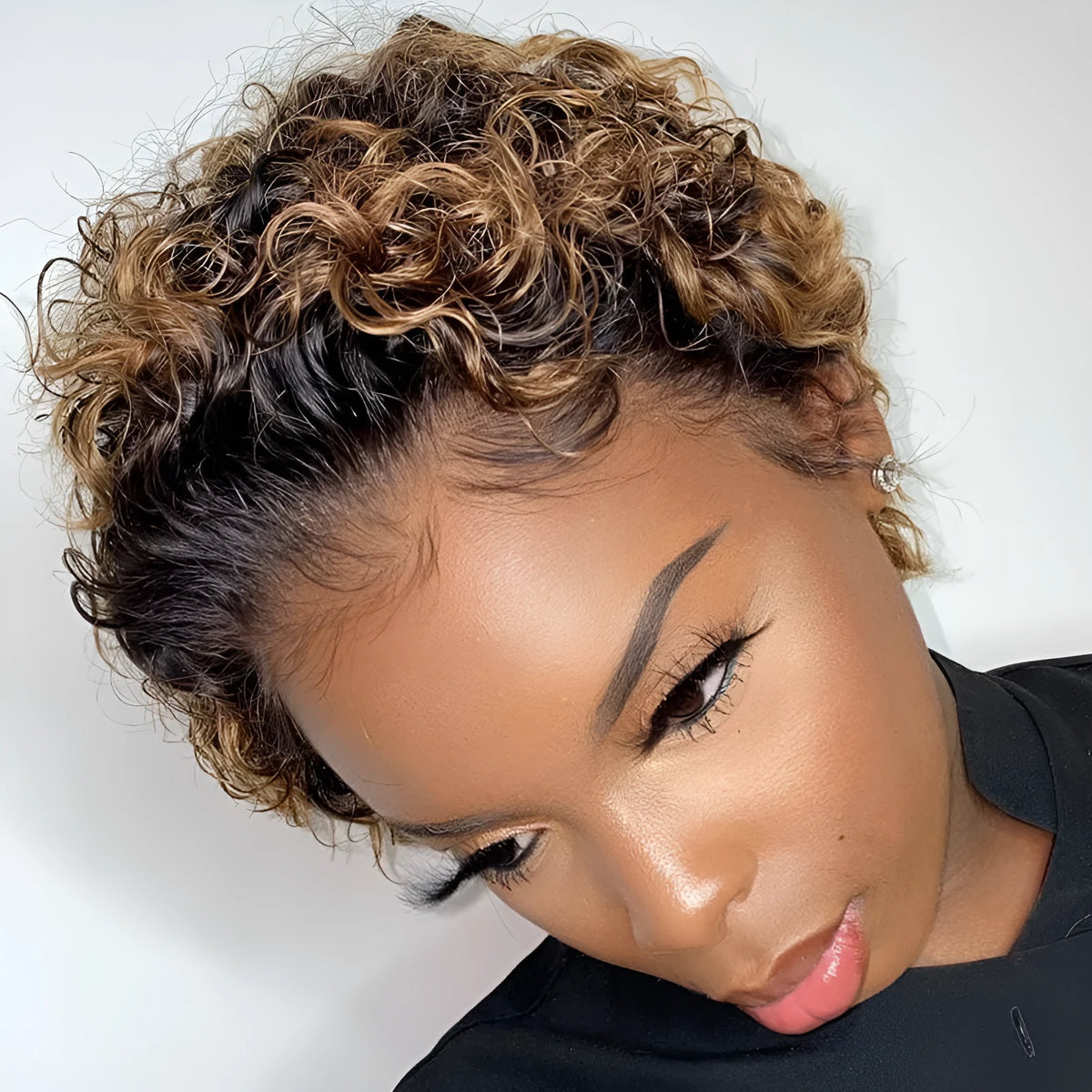 Short black afro curly wig for ladies with fluffy explosion curls and long bangs, made from dyeable high temperature fibre.