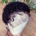 Short black afro curly wig for ladies with fluffy explosion curls and long bangs, made from dyeable high temperature fibre.