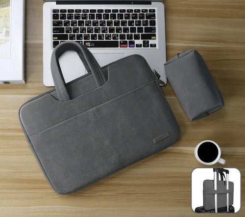 Blue universal laptop sleeve with zipper open, showing internal padded liner and organiser pockets for phone and ID.