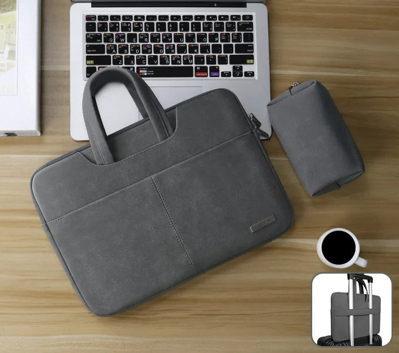 Blue PU leather laptop sleeve open to show padded interior, zipper pocket, and mobile phone slot.