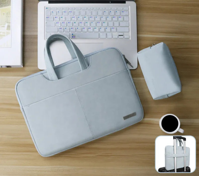 Blue universal laptop sleeve with zipper open, showing internal padded liner and organiser pockets for phone and ID.