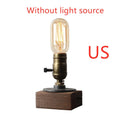 Wood and iron water pipe table lamp measuring 9 cm wide by 13 cm high