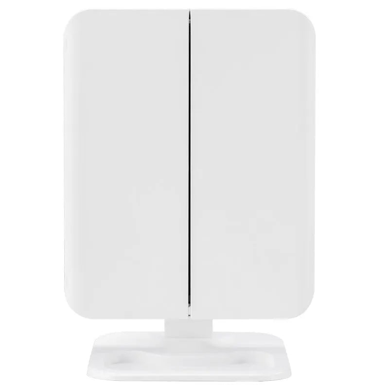 Trifold makeup mirror with 68 LED lights, 10X detachable magnifying mirror, and 180-degree rotation on a table