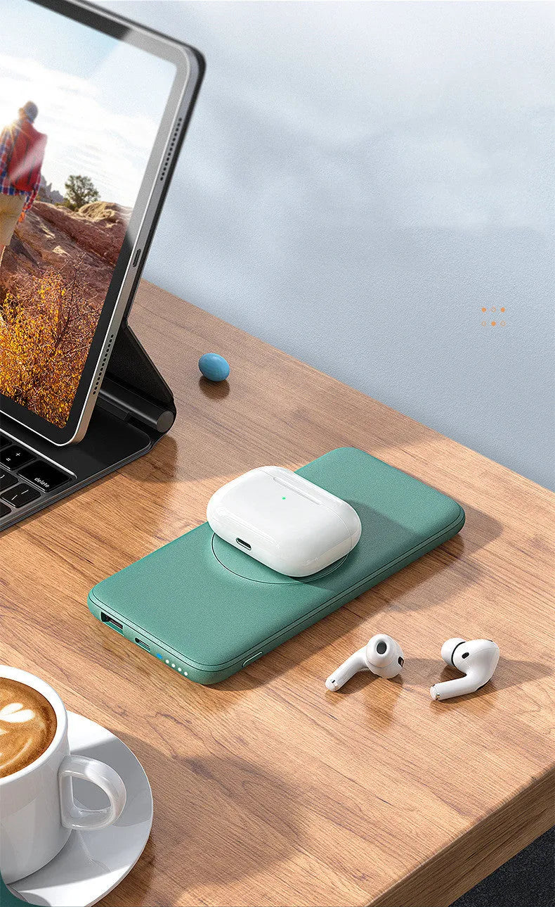 Maiduo mint green magnetic power bank attached to the back of an iPhone, showing slim clip-on design.