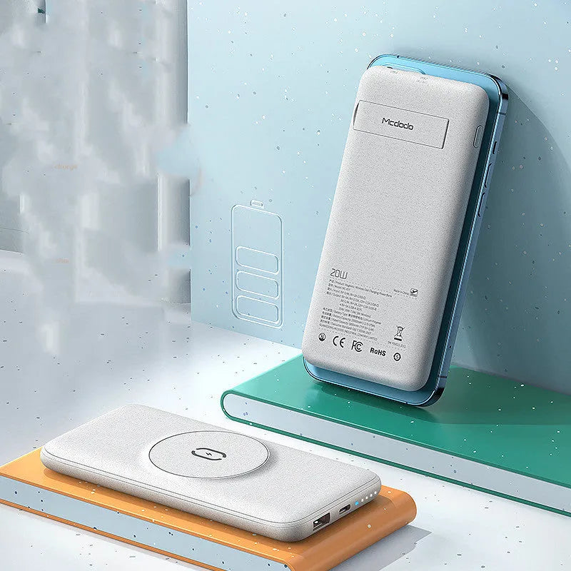 Maiduo mint green magnetic power bank attached to the back of an iPhone, showing slim clip-on design.
