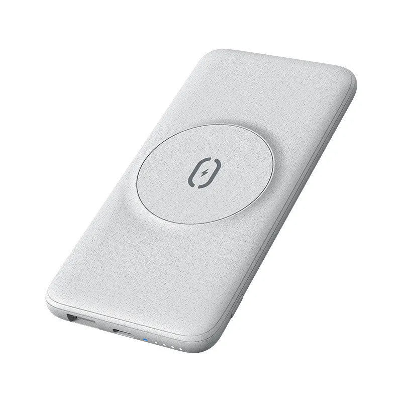 Maiduo mint green magnetic power bank attached to the back of an iPhone, showing slim clip-on design.