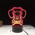 A colourful gradient acrylic remote control touch LED table lamp on a desk with a USB cable.