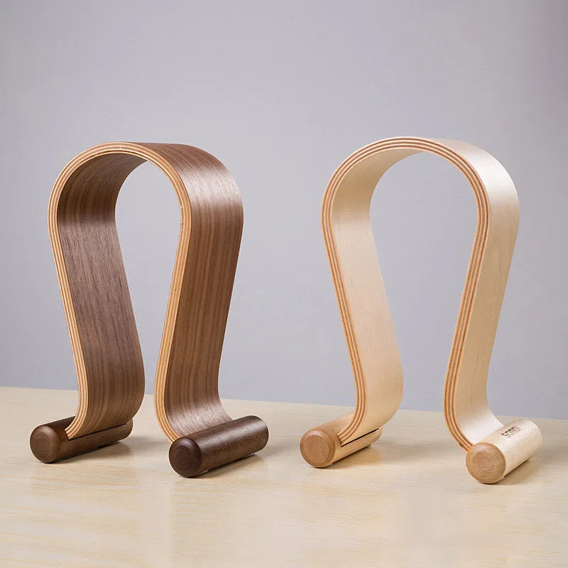 Solid wood earphone display rack with natural wood grain finish on desk