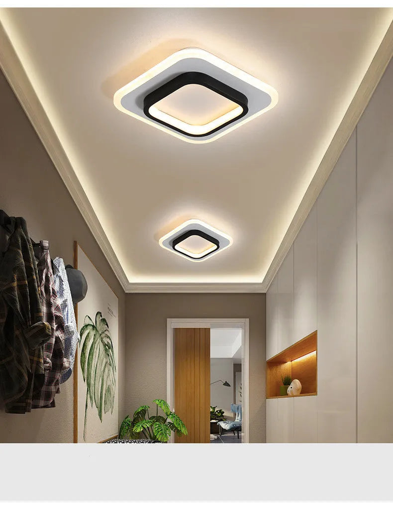 Aluminium and acrylic LED corridor light for aisles and balconies, black and white finish, circular warm light variant