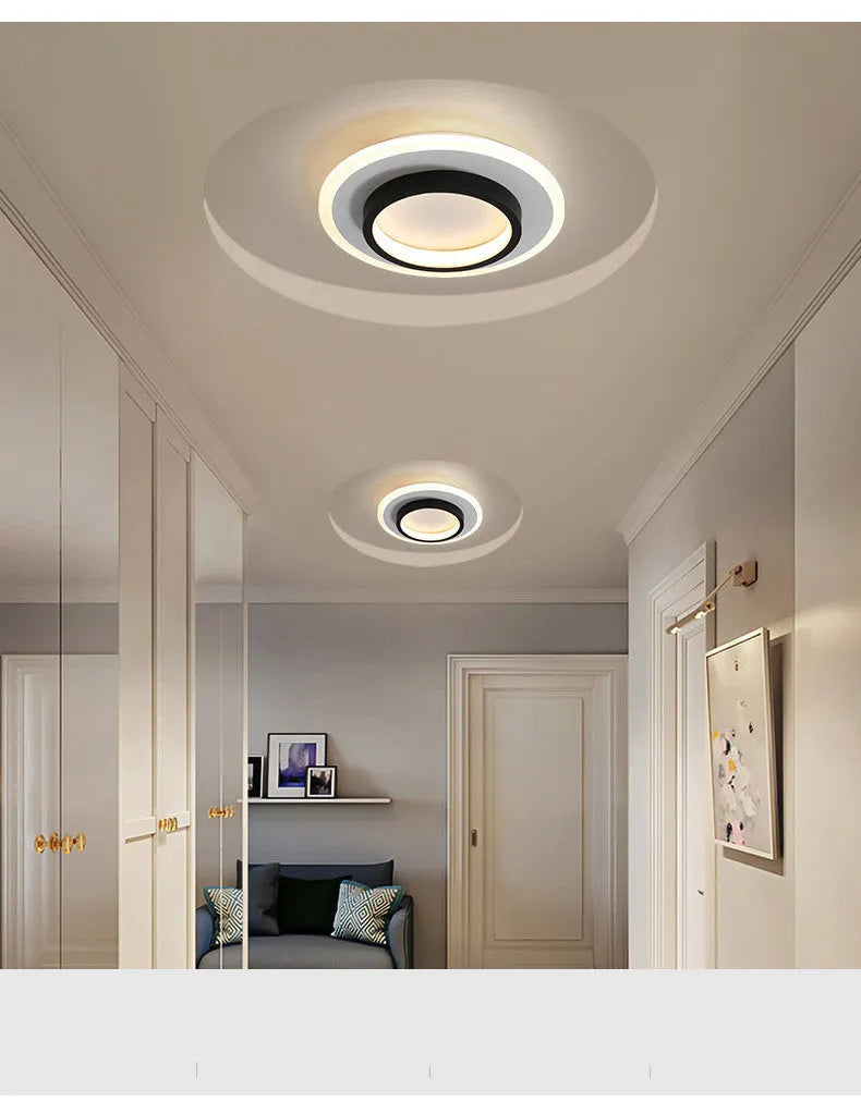 Aluminium and acrylic LED corridor light for aisles and balconies, black and white finish, circular warm light variant