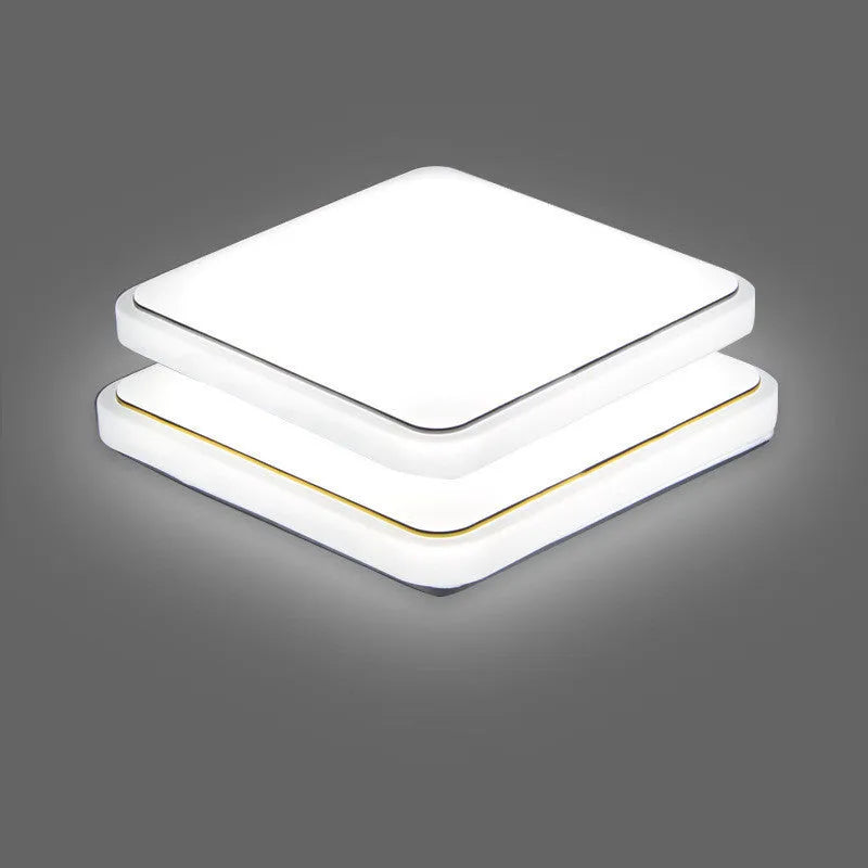 Square LED ceiling lamp with gold line trim on ceiling in a living room setting