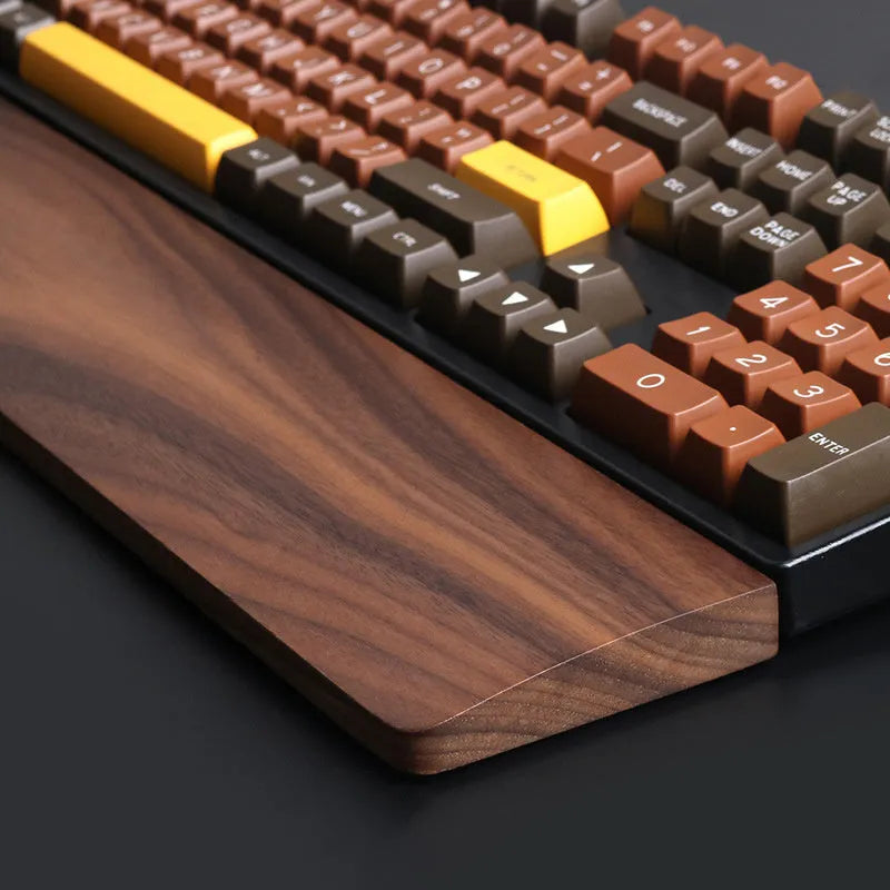 Walnut wood mechanical keyboard wrist rest showing natural wood grain finish