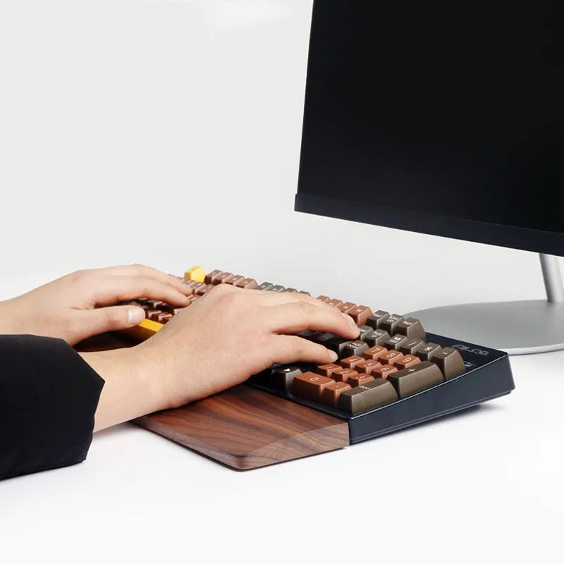 Walnut wood mechanical keyboard wrist rest showing natural wood grain finish