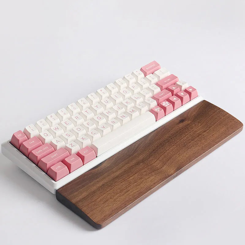 Walnut wood mechanical keyboard wrist rest showing natural wood grain finish