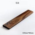 Walnut wood mechanical keyboard wrist rest showing natural wood grain finish