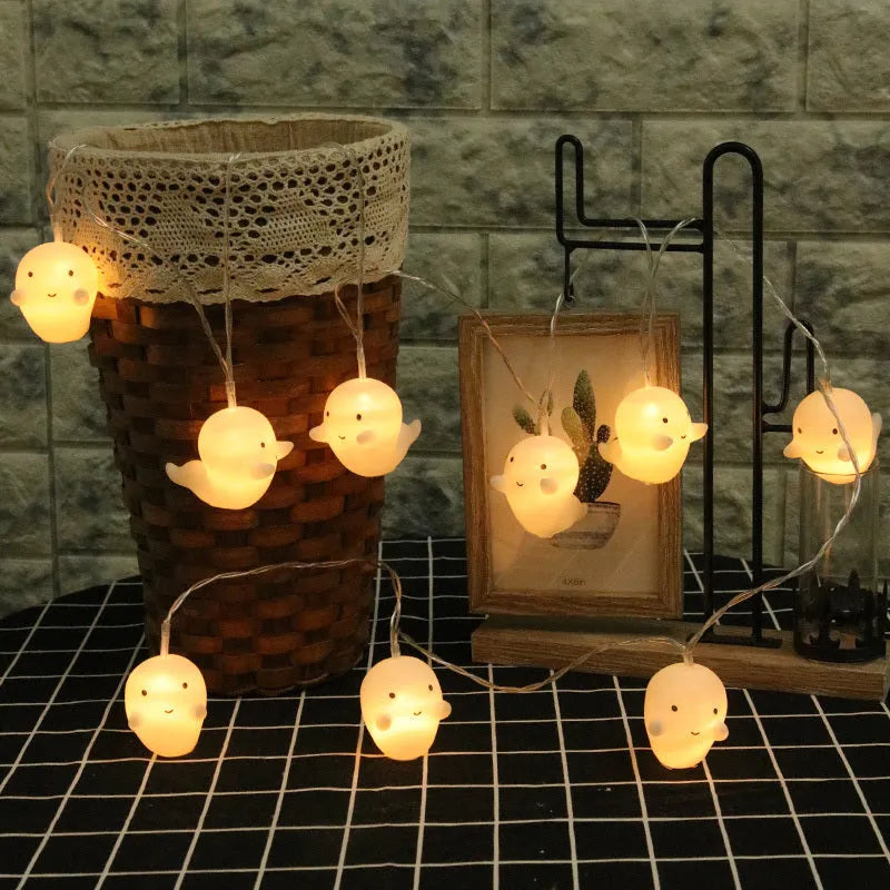 Pumpkin Ghost LED string lights with warm white bulbs on a dark background, 2m 4m 8m lengths available