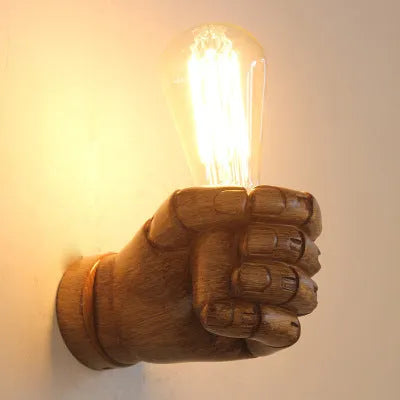 Creative resin fist wall lamp in black, white, or wood grain for left or right hand mounting.