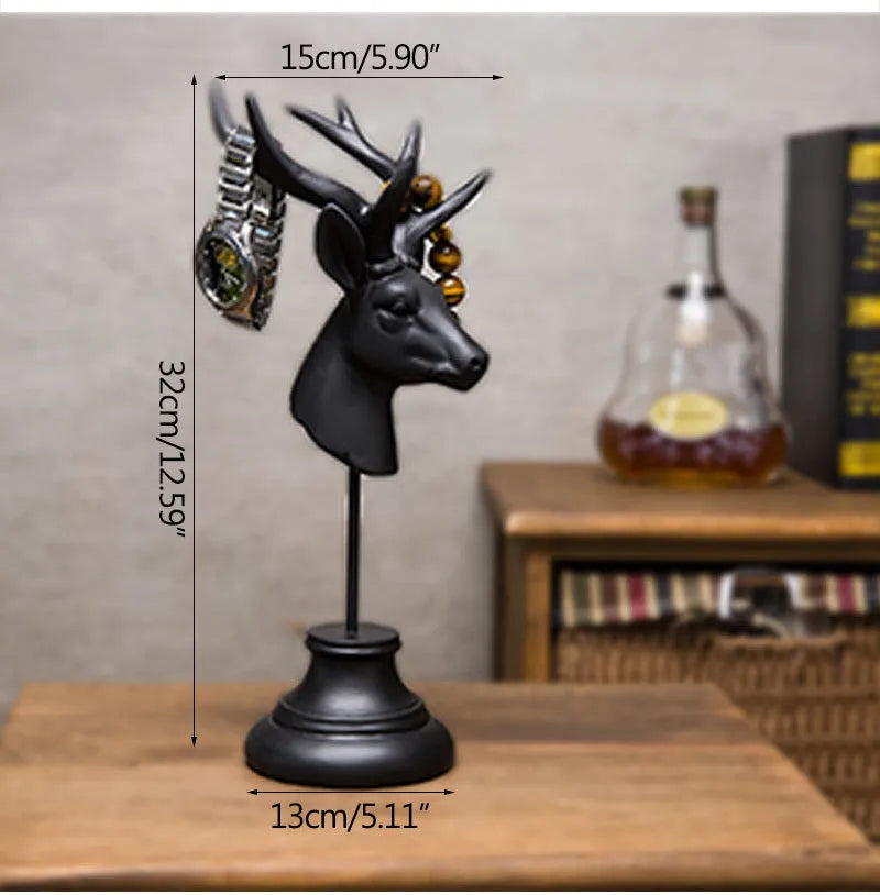A tall black animal-shaped decorative ornament made from natural resin on a wooden shelf.