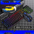 Black and white wired gaming keyboard and mouse set for computers on a desktop.