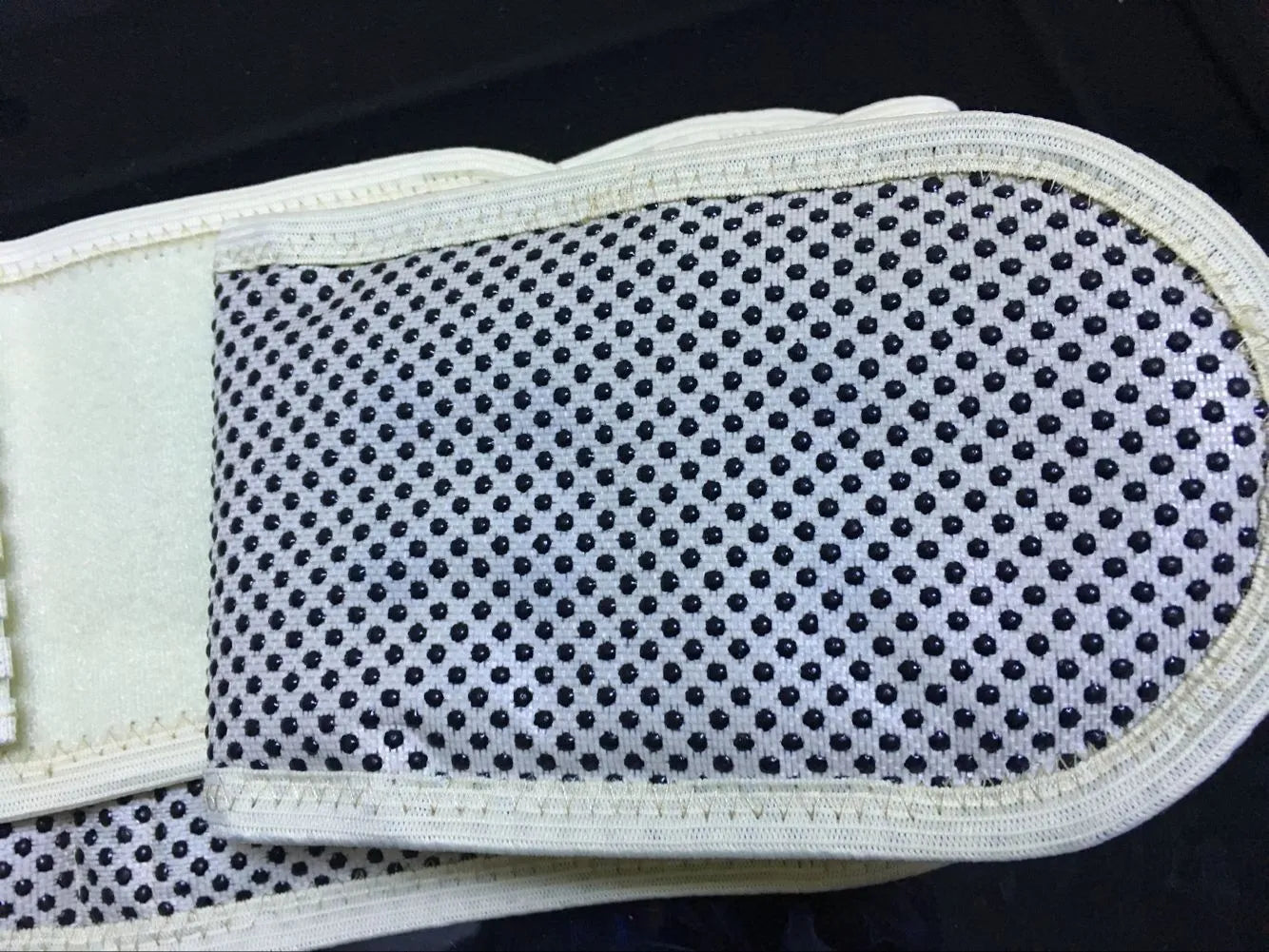 Beige self-heating magnetic waist protection fixed belt made of elastic cloth, shown laid flat.
