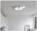 Geometric shaped iron LED light fixture in black or white for living room and bedroom.