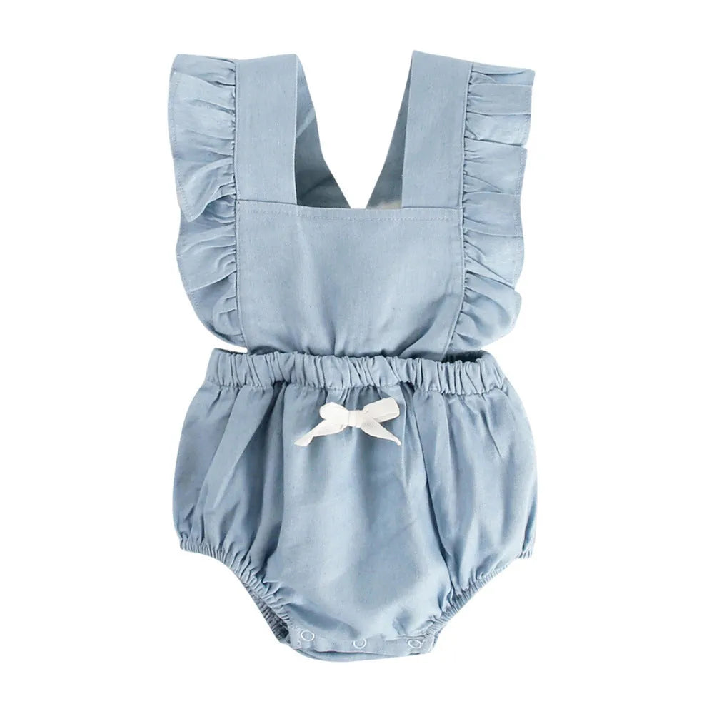 Denim blue sleeveless baby girl romper with lace trim and triangle climb detail, shown on a hanger.