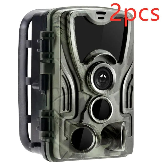 Green cellular trail camera with belt mount showing display screen and infrared LEDs