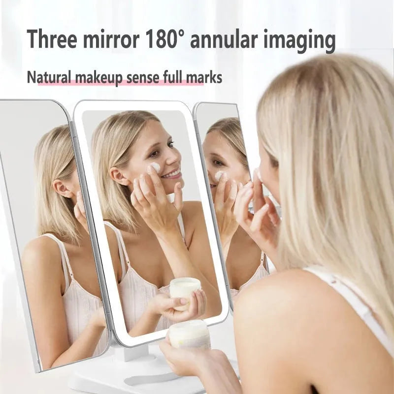 Trifold makeup mirror with 68 LED lights, 10X detachable magnifying mirror, and 180-degree rotation on a table