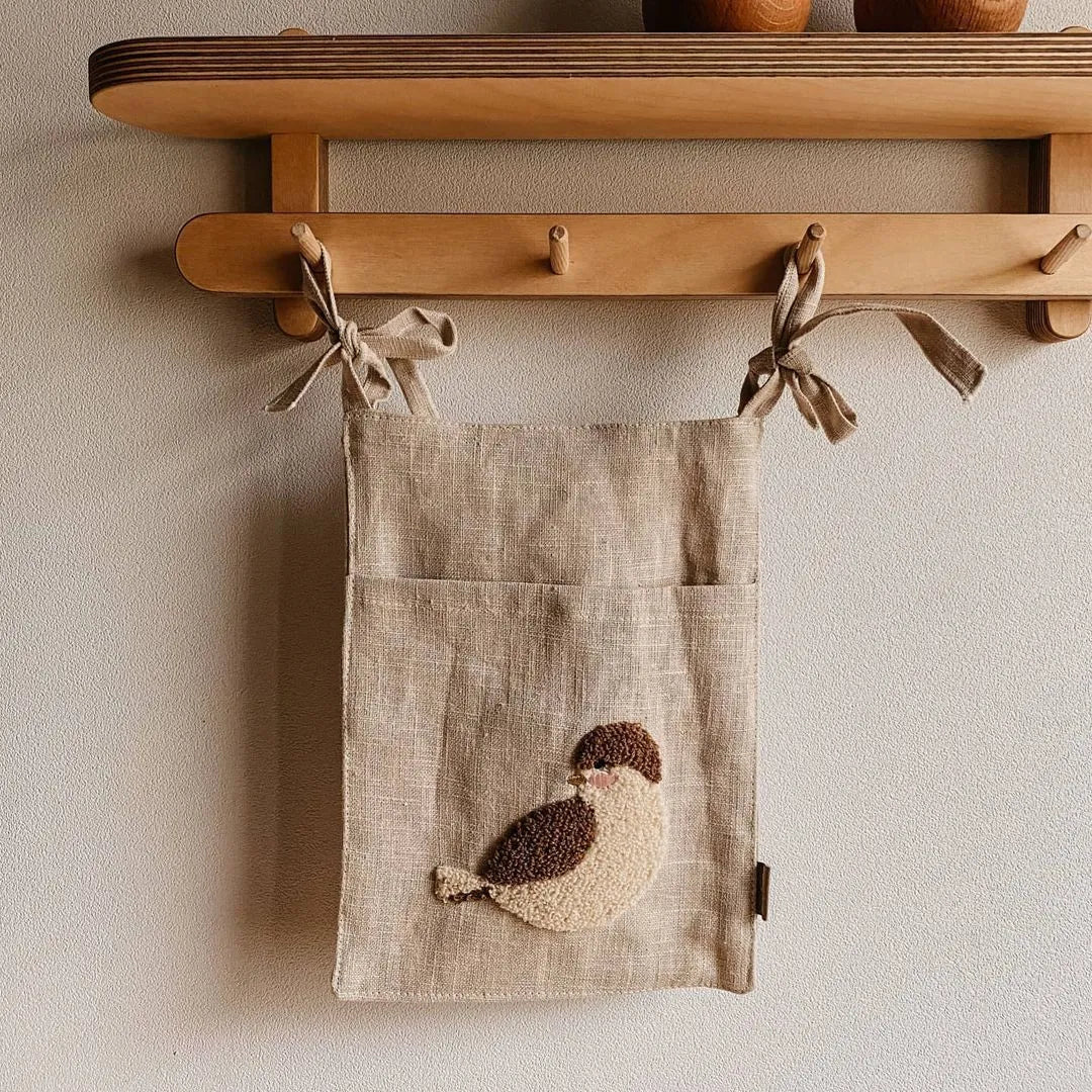Khaki cotton linen hanging storage bag with single pocket design for bedside organisation