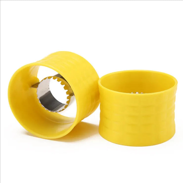 Yellow corn-shaped manual thresher with PP plastic body and stainless steel gear for removing kernels from corn cobs.