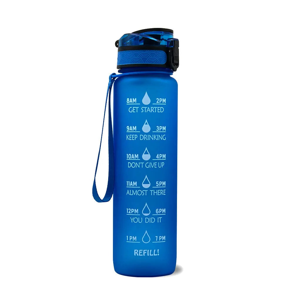 Blue and red gradient 1-litre Tritan sports water bottle with time markers, flip-top lid, and wrist strap.