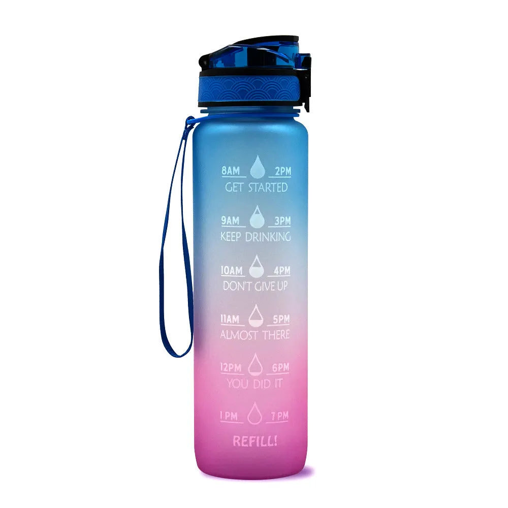 Blue and red gradient 1-litre Tritan sports water bottle with time markers, flip-top lid, and wrist strap.