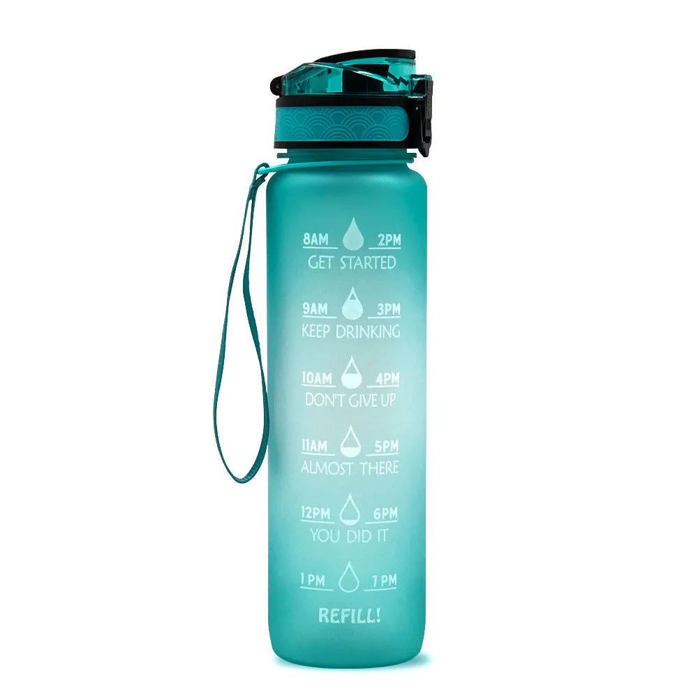 Blue and red gradient 1-litre Tritan sports water bottle with time markers, flip-top lid, and wrist strap.