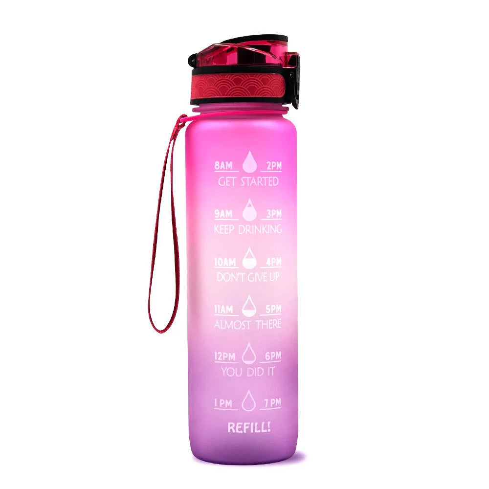Blue and red gradient 1-litre Tritan sports water bottle with time markers, flip-top lid, and wrist strap.
